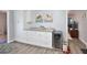 Bright butler's pantry offers ample storage with white cabinets, granite countertops, and a beverage cooler at 1409 2Nd E Ave, Bradenton, FL 34208