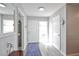 Bright and airy entryway with light gray walls and a blue patterned rug at 1409 2Nd E Ave, Bradenton, FL 34208