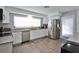 Modern kitchen featuring stainless steel appliances, bright natural lighting, and granite countertops at 1409 2Nd E Ave, Bradenton, FL 34208