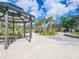 Scenic park view showcasing a covered picnic area, lush greenery, and paved walkways at 1409 2Nd E Ave, Bradenton, FL 34208