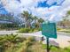 Picturesque park featuring lush landscaping, walking paths, and a historic marker under a sunny sky at 1409 2Nd E Ave, Bradenton, FL 34208