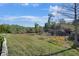 The backyard is spacious and green, backing up to a wooded area for additional privacy at 14205 Nighthawk Ter, Lakewood Ranch, FL 34202