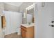 Bathroom featuring a shower with curtain and wood vanity at 14205 Nighthawk Ter, Lakewood Ranch, FL 34202