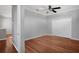 Bedroom featuring hardwood floors, a ceiling fan, and a closet at 14205 Nighthawk Ter, Lakewood Ranch, FL 34202