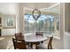 Breakfast nook with tile flooring, view of screened pool, and natural light at 14205 Nighthawk Ter, Lakewood Ranch, FL 34202