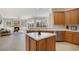 Kitchen view shows a center island, stainless steel appliances, and plenty of natural light at 14205 Nighthawk Ter, Lakewood Ranch, FL 34202
