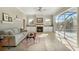Spacious living room features a fireplace, tile floors, and slider leading to a screened pool at 14205 Nighthawk Ter, Lakewood Ranch, FL 34202