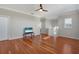 Spacious living room with hardwood floors, a ceiling fan and natural light at 14205 Nighthawk Ter, Lakewood Ranch, FL 34202