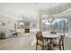 Open-concept living area boasts tile floors, fireplace, and view of screened pool at 14205 Nighthawk Ter, Lakewood Ranch, FL 34202