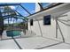 A view of the pool area and part of the exterior, including a door for access to the backyard at 14205 Nighthawk Ter, Lakewood Ranch, FL 34202