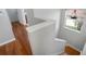 A staircase featuring hardwood floors and a bright window at 14205 Nighthawk Ter, Lakewood Ranch, FL 34202