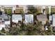 An aerial view of neighborhood homes with varying roof types and mature tree coverage at 1520 2Nd E Ave, Bradenton, FL 34208