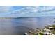 Aerial view of waterfront property featuring boat docks and lush green lawns at 1520 2Nd E Ave, Bradenton, FL 34208