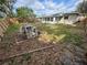 Spacious backyard with a privacy fence, patio structure, and lush foliage at 1520 2Nd E Ave, Bradenton, FL 34208