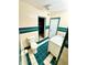 Bright bathroom with decorative tile, toilet, and classic sink vanity at 1520 2Nd E Ave, Bradenton, FL 34208