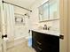 Stylish bathroom with a modern vanity, bathtub, and updated fixtures at 1520 2Nd E Ave, Bradenton, FL 34208