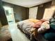 Relaxing bedroom with a comfortable bed, accent wall, and a tranquil ambiance at 1520 2Nd E Ave, Bradenton, FL 34208
