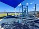 Outdoor exercise area with blue equipment offering waterfront views for a workout at 1520 2Nd E Ave, Bradenton, FL 34208