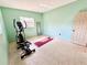 Bright exercise room with fitness equipment and yoga mat at 1520 2Nd E Ave, Bradenton, FL 34208