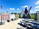 Veterans War Memorial featuring plaques, statues, and benches, set in a landscaped area with flags at 1520 2Nd E Ave, Bradenton, FL 34208