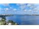Expansive water view featuring a city skyline and bridge under a blue sky dotted with fluffy white clouds at 1520 2Nd E Ave, Bradenton, FL 34208