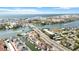 Scenic aerial view of coastal community featuring a waterway, bridge, and colorful waterfront houses at 1621 Memory Ln, Sarasota, FL 34231