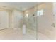 Elegant bathroom highlighting a walk-in shower with glass enclosure and a dual shower head system at 16218 Umbria Pl, Bradenton, FL 34211