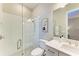 Bright bathroom featuring a glass enclosed shower, toilet, and white vanity with gray countertop at 16218 Umbria Pl, Bradenton, FL 34211