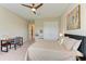 Bedroom featuring a ceiling fan, study desk, and a double door closet at 16218 Umbria Pl, Bradenton, FL 34211