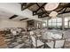 Spacious dining area featuring high ceilings, large windows, a fireplace, and stylish pendant lighting at 16218 Umbria Pl, Bradenton, FL 34211