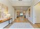 Elegant entryway with wood-look tile floors, neutral walls, and decor that enhances a welcoming ambiance at 16218 Umbria Pl, Bradenton, FL 34211