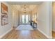 Elegant entryway with wood-look tile floors, neutral walls, and decor that enhances a welcoming ambiance at 16218 Umbria Pl, Bradenton, FL 34211