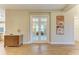 Elegant hallway with wood-look tile flooring and double doors leading to another room at 16218 Umbria Pl, Bradenton, FL 34211