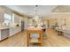 Open-concept kitchen boasts a large island, stainless steel appliances, and bright white cabinetry at 16218 Umbria Pl, Bradenton, FL 34211