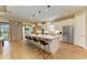 Spacious kitchen island features pendant lighting, seating, and modern appliances at 16218 Umbria Pl, Bradenton, FL 34211