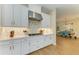 Modern kitchen featuring stainless steel appliances and white cabinetry at 16218 Umbria Pl, Bradenton, FL 34211