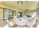 Covered lanai with a dining table, outdoor seating, and sliding glass doors to the home at 16218 Umbria Pl, Bradenton, FL 34211