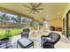 Spacious screened lanai with multiple seating areas and views of the lush backyard at 16218 Umbria Pl, Bradenton, FL 34211
