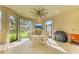 Outdoor lanai features a ceiling fan, fireplace and a barbeque grill at 16218 Umbria Pl, Bradenton, FL 34211