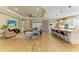 Open-concept living area with tile floors, neutral walls, and breakfast bar offers a cohesive and inviting space at 16218 Umbria Pl, Bradenton, FL 34211