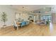 Open-concept floor plan boasts a dining area, living room with a ceiling fan, and seamless flow for entertaining at 16218 Umbria Pl, Bradenton, FL 34211