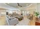 Spacious living room with tile floors, neutral tones, and an open floor plan at 16218 Umbria Pl, Bradenton, FL 34211