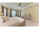 Comfortable main bedroom with tray ceiling, carpet, neutral tones, and generous window light at 16218 Umbria Pl, Bradenton, FL 34211