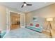 Comfortable office space with stylish decor, French doors, and a blue sofa at 16218 Umbria Pl, Bradenton, FL 34211