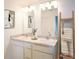 Bright bathroom features double sinks, modern fixtures, and stylish decor with a spa-like feel at 16275 Banyan Ave, Port Charlotte, FL 33954