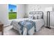 Cozy bedroom with large window, neutral walls, comfortable bed, and minimalist decor at 16275 Banyan Ave, Port Charlotte, FL 33954
