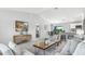 Inviting living room features neutral walls, modern decor, stylish furniture, and lots of space at 16275 Banyan Ave, Port Charlotte, FL 33954