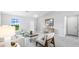 Spacious living room boasts a large window, neutral walls, stylish decor, and comfortable seating at 16275 Banyan Ave, Port Charlotte, FL 33954
