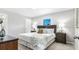 Serene main bedroom featuring neutral walls, comfortable bed, and two nightstands with lamps at 16275 Banyan Ave, Port Charlotte, FL 33954
