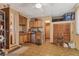 Unfinished room with exposed wood paneling featuring a glimpse into another room at 205 45Th W St, Bradenton, FL 34209